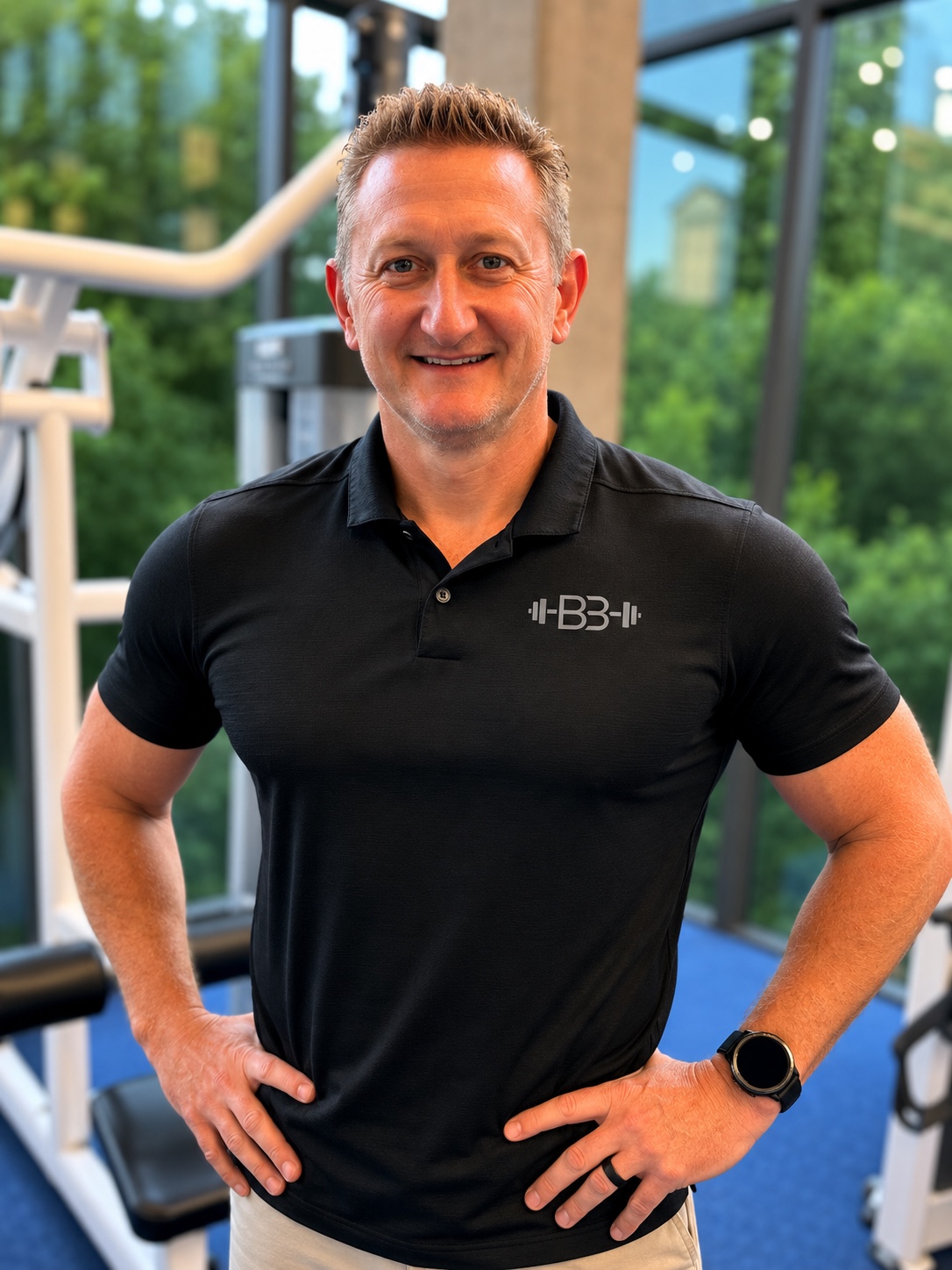 Bryan Bolding at the gym wearing a black BB Elite Fitness polo